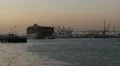 Container Ship Leaves Port at Sunset HD Footage
