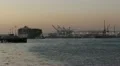 Container Ship Leaves Port at Sunset HD Footage