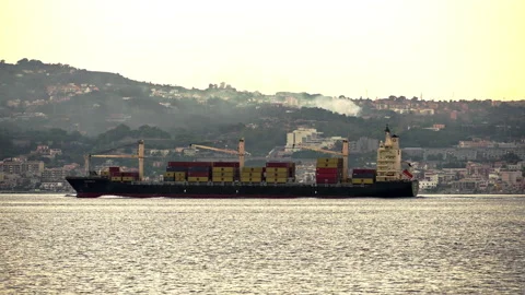 A container ship loaded sails in the international port of Hamburg Stock Footage 233464201