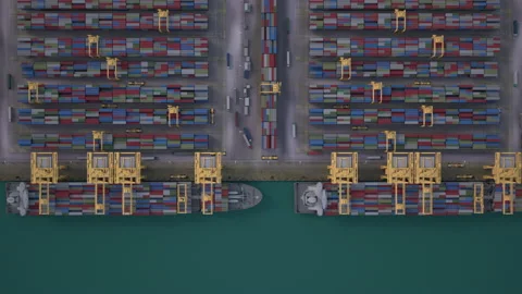 Container ship loading and unloading in deep sea port, Aerial view of business l Stock Footage 164449562
