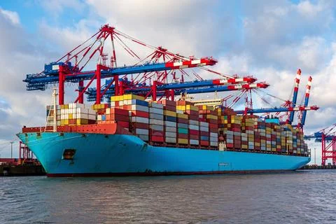 Container ship loading and unloading in port. Logistic import and export fr.. Stock-Fotos