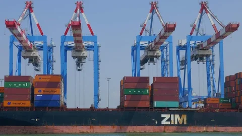 Container ship loading by cranes industrial line timelapse creative business  4k Stock Footage 105803796