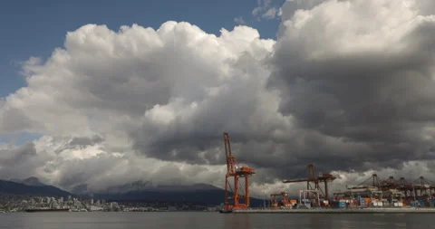 Container ship loading docks with crane empty on cloudy day - wide shot Stock Footage 244489984