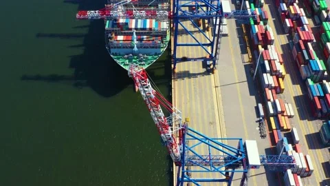 Container ship loading at port with crane, container ship carrying container  Stock Footage 147405411