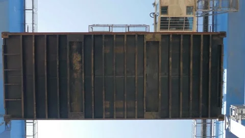 Container ship loading / unloading by industrial line gantry crane 4k creative b Stock Footage 140675878