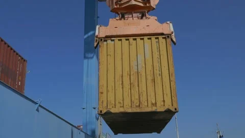 Container ship loading / unloading by industrial line gantry crane 4k creative b Stock Footage 140676350