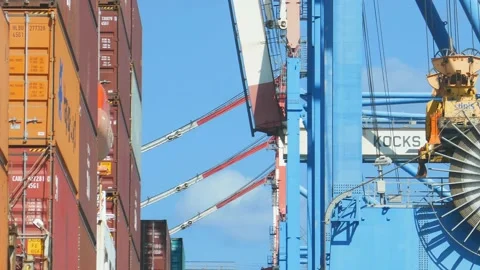 Container ship loading / unloading by industrial line gantry crane 4k creative b Stock Footage 140678718