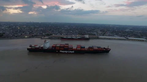 Container ship on Mississippi River, Sunset over skyline, New Orleans, LA, Stock Footage 53559434