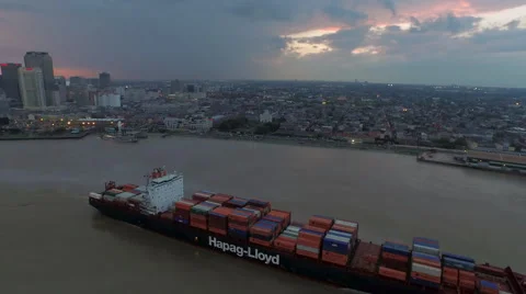 Container ship on Mississippi River, Sunset over skyline, New Orleans, LA, Video stock 53559828