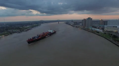 Container ship on Mississippi River, Sunset over skyline, New Orleans, LA, Stock Footage 53561663