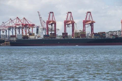 Container Ship Moored in Harbour Loading Cargo Stock Photos