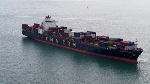 Container ship navigates open waters with stacked cargo Stock Footage 341720394