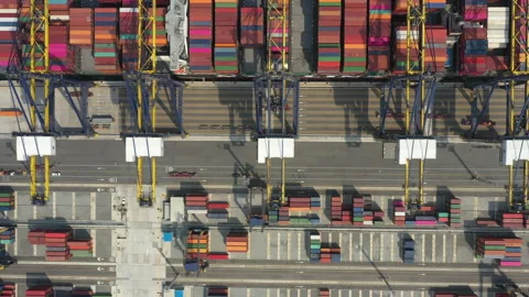 Container ship navigating into a busy industrial port Stock Footage 287068832