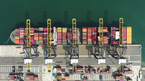 Container ship navigating into a busy industrial port Stock Footage 287070714