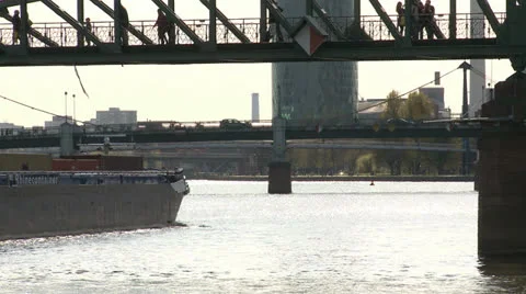 Container ship navigating the river in urban environment Stock Footage 24974704