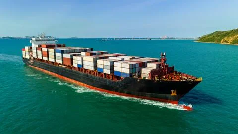 Container Ship Navigating Turquoise Ocean Waters Transporting Cargo High An.. Stock Photos