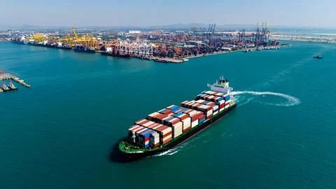 Container Ship Navigating Turquoise Ocean Waters By Laem Chabang Port High .. Stock Photos