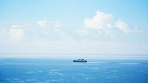 Container ship in navigation on the horizon Stock Photos