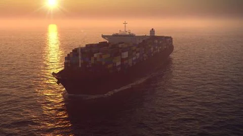 Container ship in ocean at sunset Stock Illustration