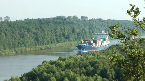 Container ship passing the Kiel Canal, Germany Stock Footage 40652690