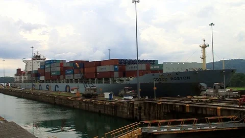 Container ship is passing through Gatun Locks Stock Footage 122993423