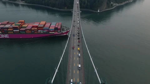 Container ship passing under Lions Gate bridge Vancouver 動画素材 248478085