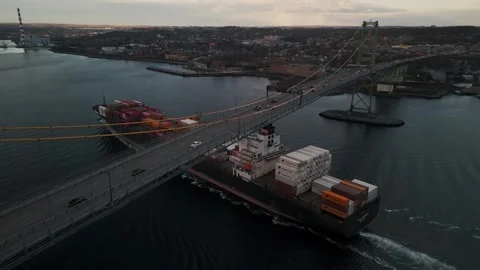 Container ship passing under the suspension bridge in port of Halifax Top Stock Footage 272628988