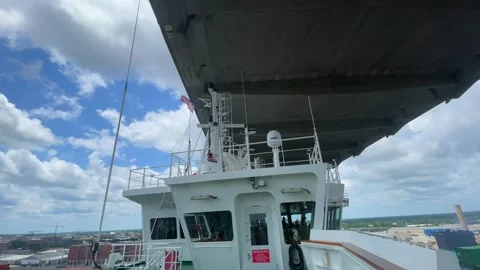Container ship passing under the Talmadge Memorial Bridge Stock Footage 242828056