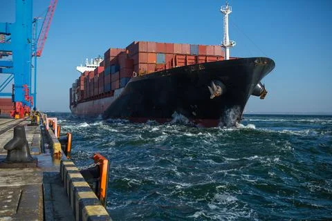 Container ship in port at container terminal. Ships of container ships stand  Stock Photos