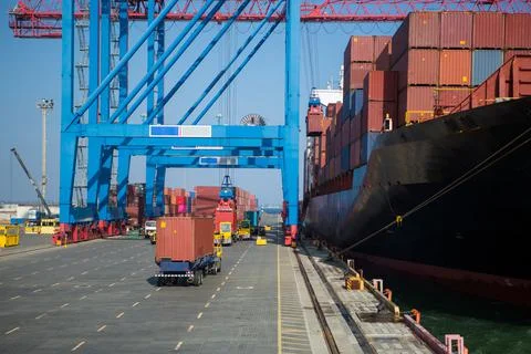 Container ship in port at container terminal. Ships of container ships stand  Stock Photos