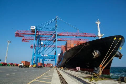 Container ship in port at container terminal. Ships of container ships stand  Stock Photos