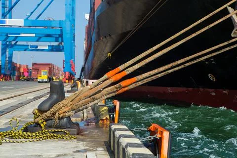 Container ship in port at container terminal. Ships of container ships stand  Stock Photos