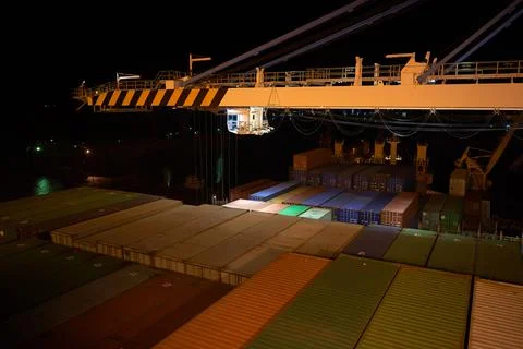 Container ship in port at container terminal. Ships of container ships stand  Stock Photos