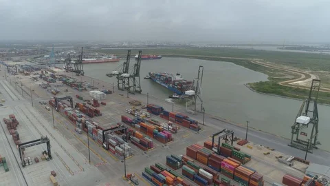Container Ship With Port in Foreground Stock Footage 129958932
