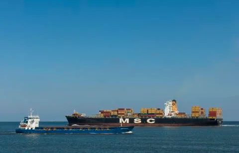 Container ship in port of rotterdam Stock Photos