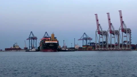Container ship in the port. Ship with containers in the sea port. unloading a Video stock 197681509