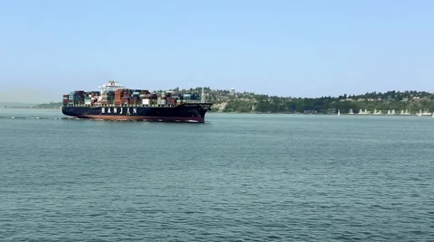 Container Ship in Puget Sound Passing a Marina Stock Footage 51787359