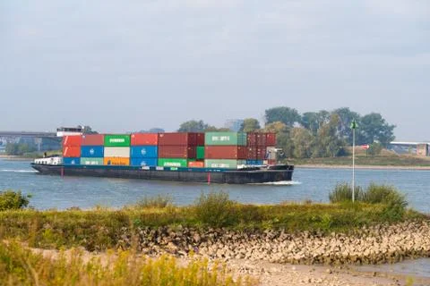 Container ship on river Stock Photos