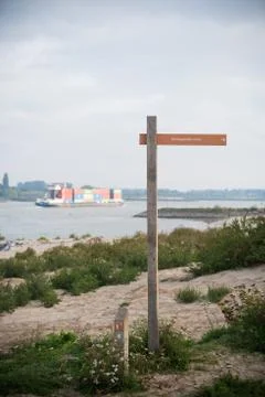Container ship on river Stock Photos