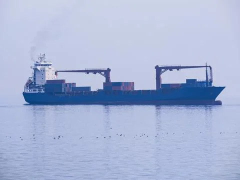 Container ship sailing in the open sea Фото