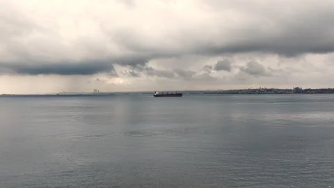 Container ship sails along the Bosphorus, against the background of Istanbul. Stock Footage 324910942