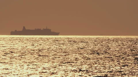 Container ship silhouette, far in the middle of the ocean Stock Footage 66517544