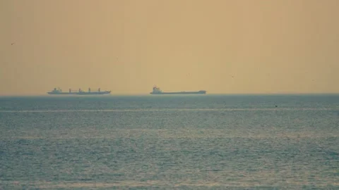 Container ship at sunset on the sea Stock Footage 134024007