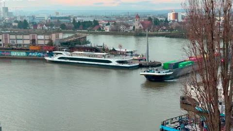 A container ship turns from the Rhine into a harbor basin in Basel Видео 331296422