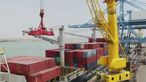 Container ship unloading at busy port with crane operations in progress Stock Footage 318206400
