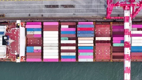 Container ship unloading cargo at bustling cargo port in vibrant maritime hub Stock Footage 334641515