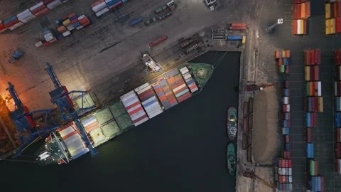 Container ship is unloading in the port in the evening aerial top down view Stock Footage 223182157