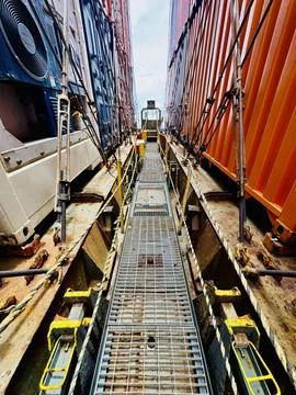Container Ship Walkway Between Stacked Cargo Containers Stock Photos
