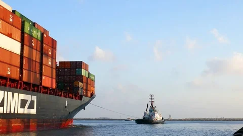 Container ship was pull by tug boat 4k intro video for business Stock Footage 95065038