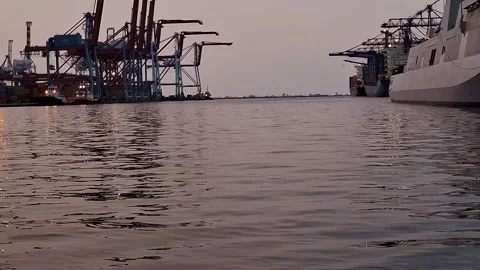 Container ships loading and discharging by shore crane at port. Stock Footage 314616945